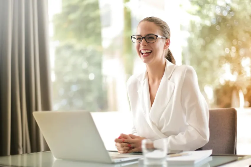 businesswoman working in office with laptop